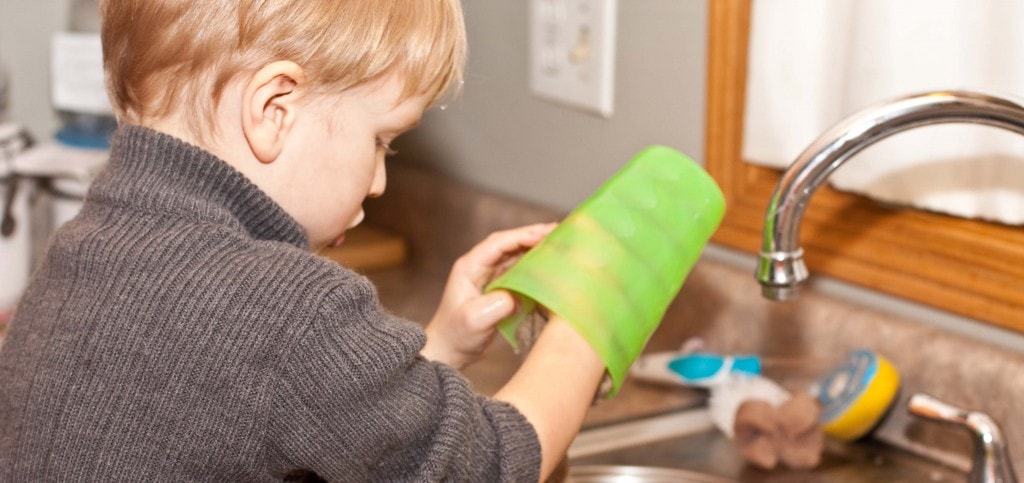 boy washing a glass