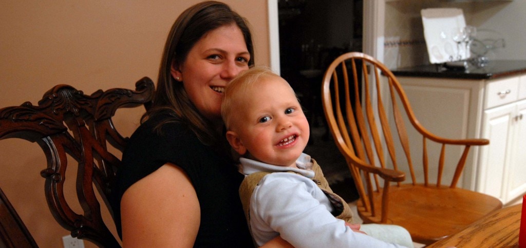 mom and toddler son smiling