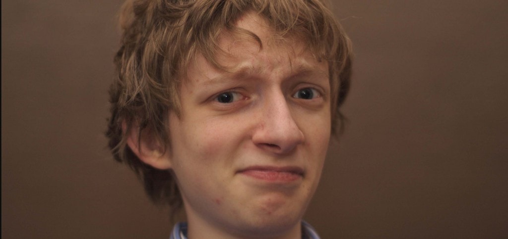 teenage boy is confused