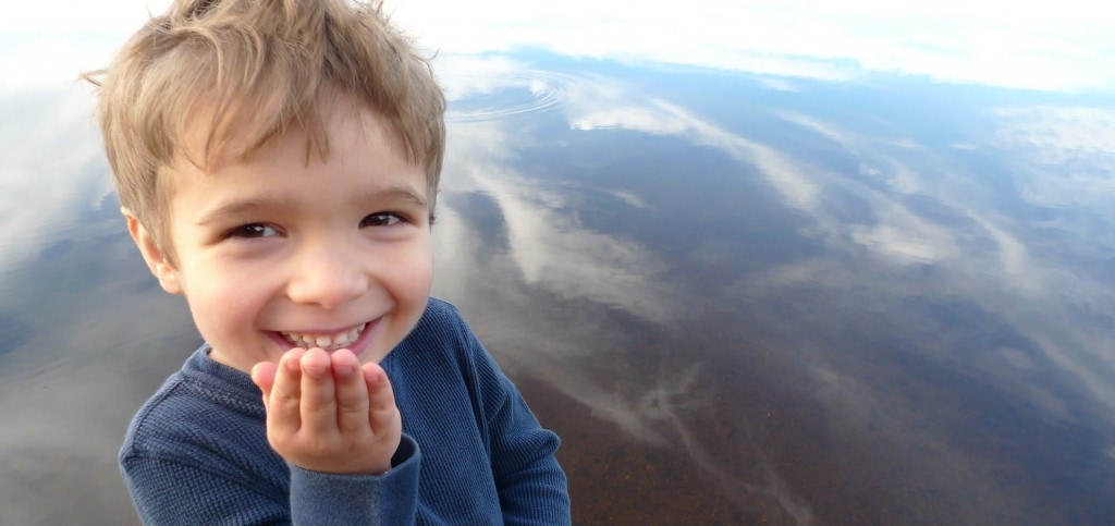 Boy blowing kisses at the camera