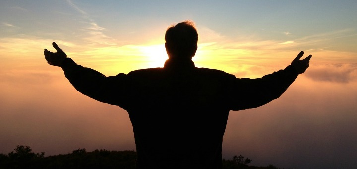 man with outstretched arms